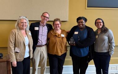 Honors Program team members pose for a photo with Vice Provost Steven Girardot and EECC Chair Kristi Hesse.