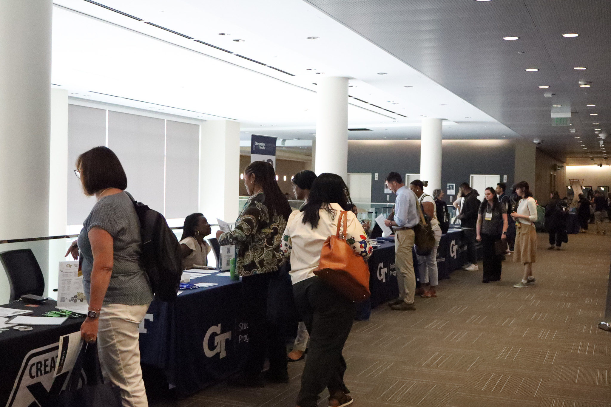 Conference participants engaging at the resource fair.