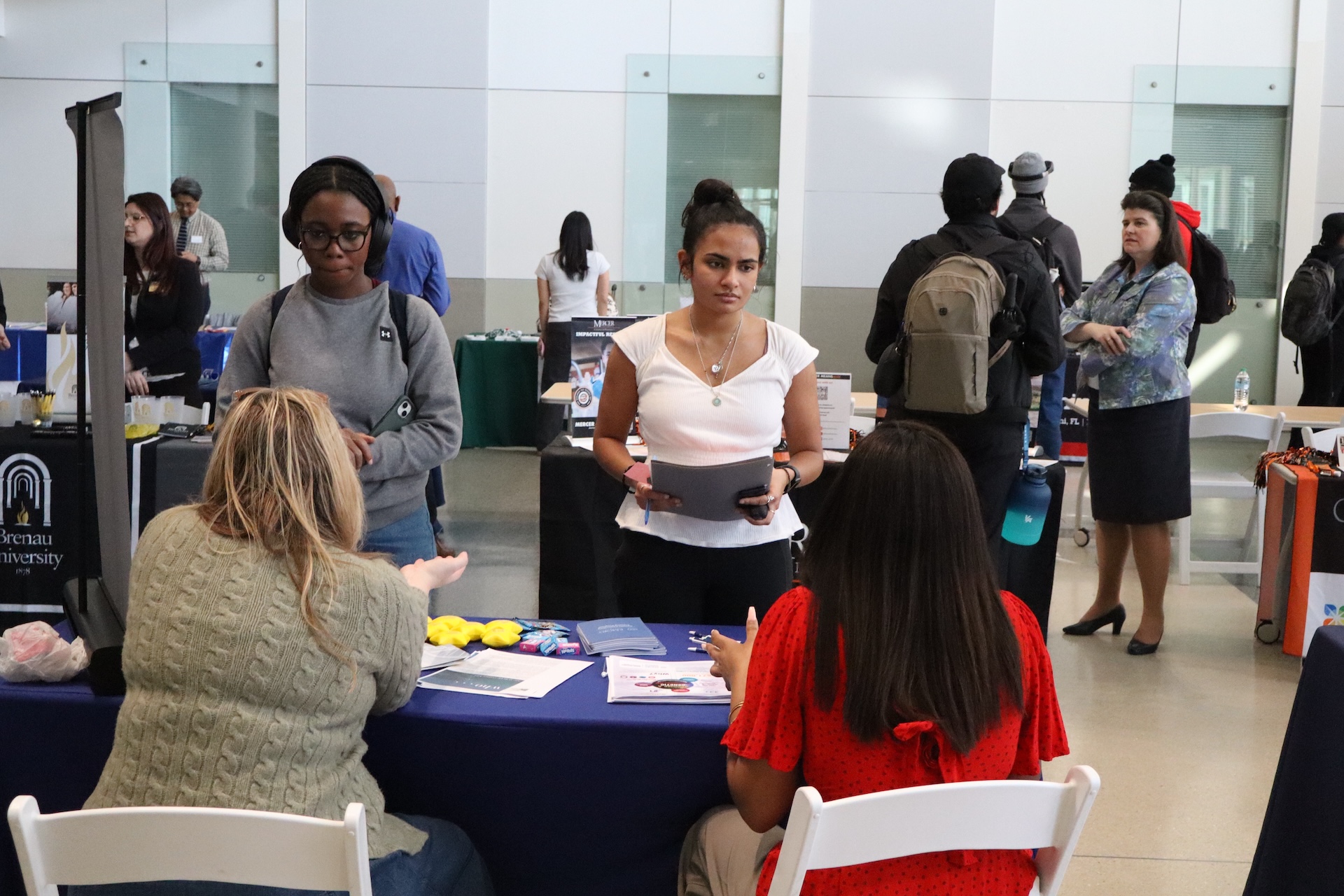 Students speaking with a health professional recruiter. 
