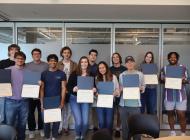 2021 and 2022 FYSA cohort graduates pose for a group picture with their certificates.