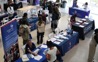 Student networking at the health professional school fair.