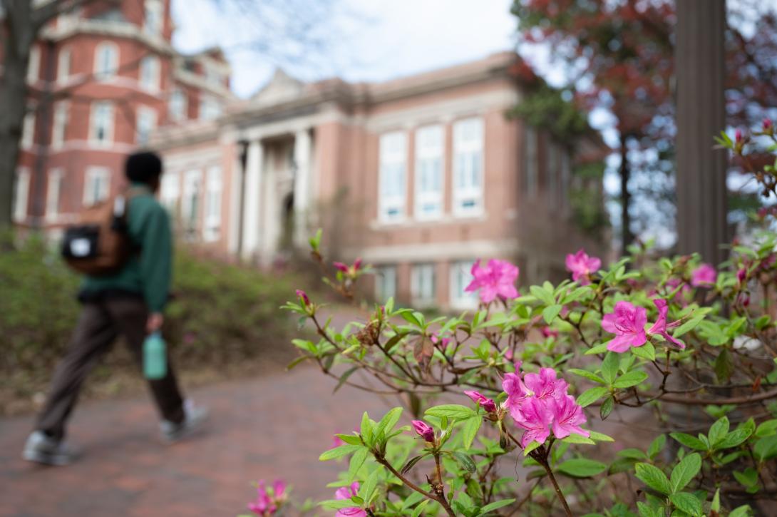 Student walking by Tech Tower.