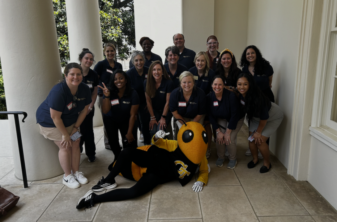 GTAAN Best Practices planning committee pose with Buzz.